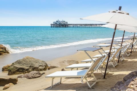 Private beach, white sand, sun loungers, beach umbrellas