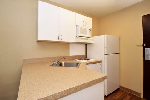 Studio, 1 King Bed, Non Smoking | Private kitchen | Full-size fridge, microwave, stovetop, cookware/dishes/utensils