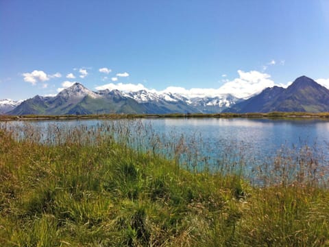 Sky, Snow, Mountain, Slope, Cloud, Ice Cap, Sports Equipment, Outdoor Recreation, Terrain, Freezing