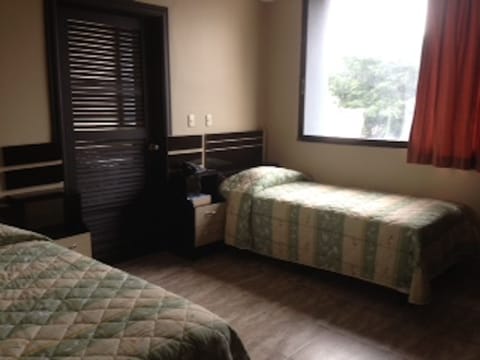 Standard Room, Multiple Beds | Down comforters, in-room safe, blackout drapes, free WiFi