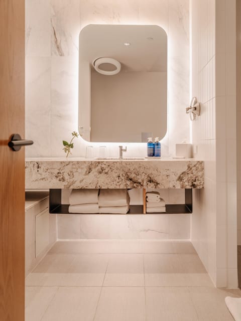 Designer toiletries, hair dryer, bathrobes, slippers