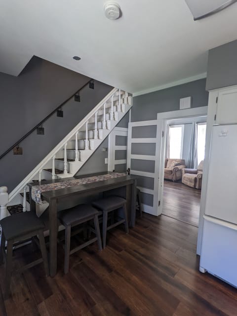 This table can seat 4. The shorter table in the living room can also seat 4.