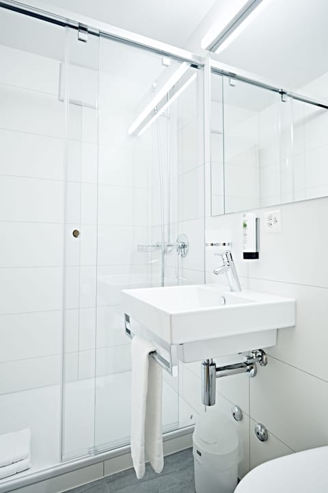 Hypo-allergenic bedding, desk, laptop workspace, blackout drapes