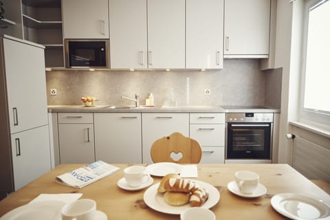 Comfort Apartment, 1 Bedroom | Private kitchen | Full-size fridge, stovetop, coffee/tea maker, electric kettle