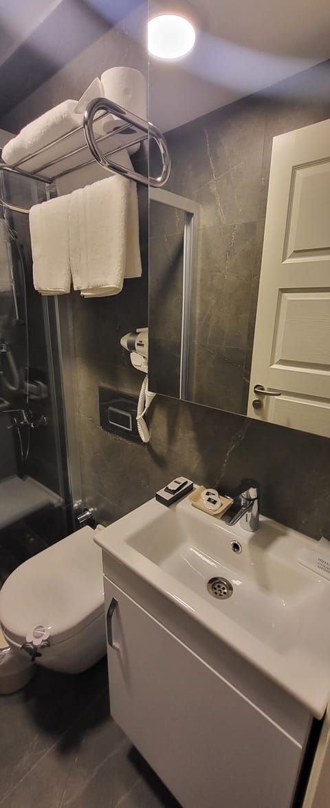 Room | Bathroom | Shower, rainfall showerhead, hair dryer, slippers