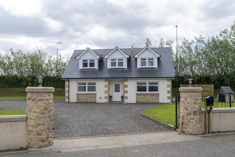 Large detached property accessed through electric gates