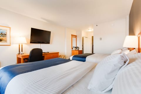 Double Room, 2 Queen Beds | Living area | 32-inch LCD TV with digital channels, TV, iPod dock