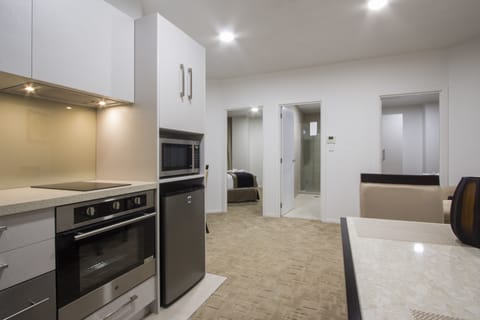 Two-Bedroom Suite | Private kitchen | Fridge, microwave, electric kettle, toaster