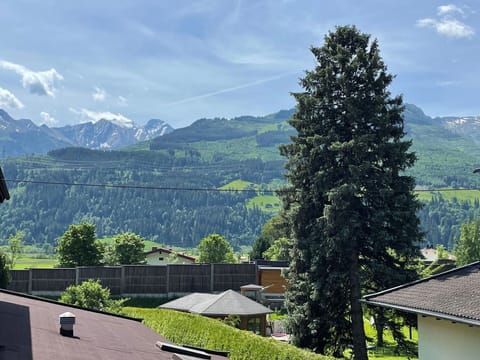Cloud, Sky, Mountain, Daytime, Plant, Building, Ecoregion, Nature, Highland, Tree