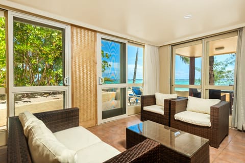 Grand Beachfront Suite | Living area | 32-inch flat-screen TV with satellite channels, TV