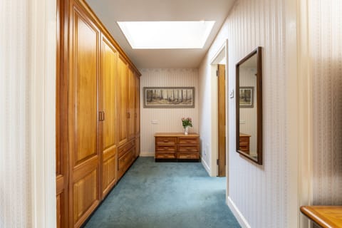 Dressing area with large fitted wardrobes