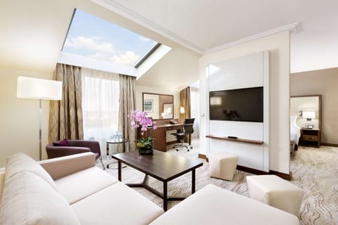 Deluxe Suite, 1 King Bed | Living area | 40-inch flat-screen TV with premium channels, TV