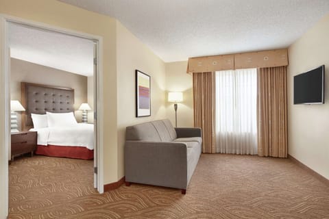 Suite, 1 Queen Bed, Accessible, Bathtub | Living area | 37-inch TV with cable channels, pay movies, MP3 dock