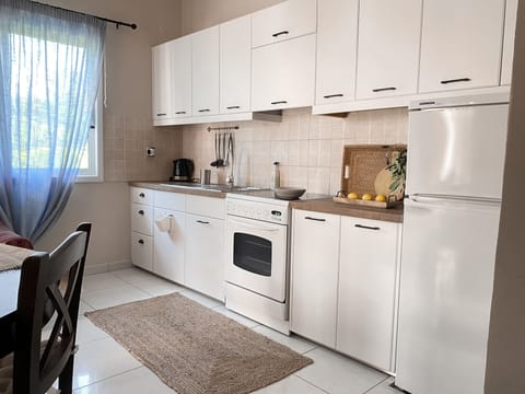 Apartment, 2 Bedrooms | Private kitchen | Full-size fridge, oven, stovetop, coffee/tea maker