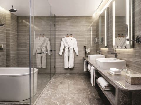 Executive Suite | Bathroom | Separate tub and shower, rainfall showerhead, designer toiletries