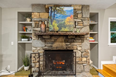 Each living room on levels 1 & 2 has a gorgeous stone fireplace includes an electric fire with flames, heat, or both. Level 2 Art: "Deciduous Forest in Autumn, Blue Ridge Parkway, North Carolina"