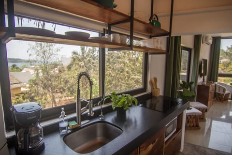 Villa 9 | Private kitchen | Fridge, microwave, stovetop, toaster