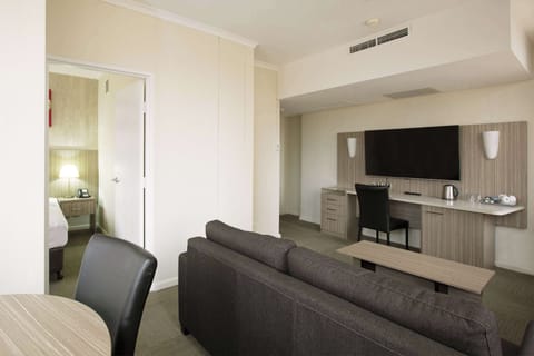 Junior Suite | Living area | 43-inch flat-screen TV with digital channels, TV