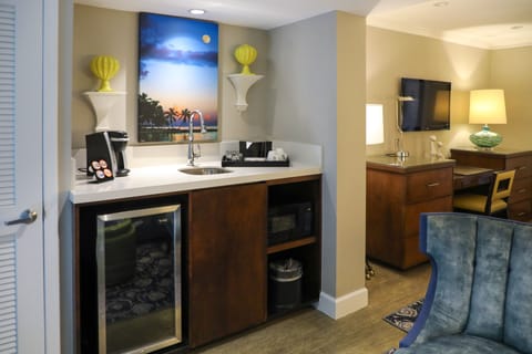 Junior Spa King Suite | Living area | 27-inch flat-screen TV with cable channels, TV, iPod dock