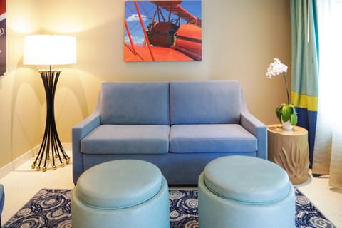 Premium Suite | Living room | 42-inch LED TV with satellite channels, TV, iPod dock