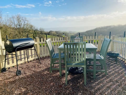 The private garden patio area with Bbq with amazing views over the valley below.