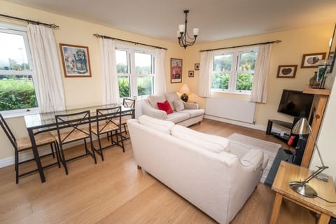 A light and spacious living/dining area with smart TV