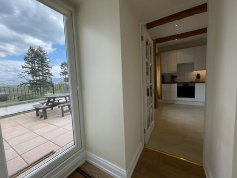 The property has access to a wonderful patio area, overlooking the gardens and breath-taking views