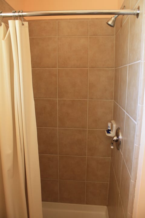 Deluxe Room, 1 King Bed | Bathroom shower