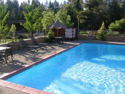 Seasonal outdoor pool, open 10:00 AM to 9:00 PM, pool umbrellas