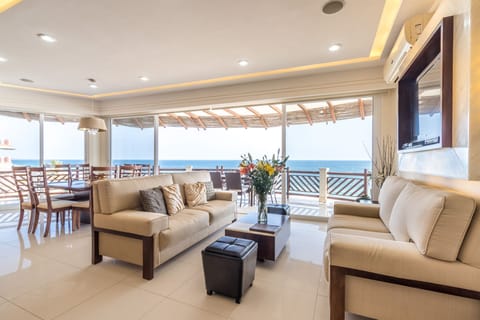 Penthouse, 4 Bedrooms, Oceanfront | Living area | 32-inch plasma TV with satellite channels, TV, DVD player