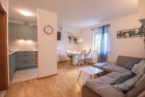 Living room with a kitchen and dining area