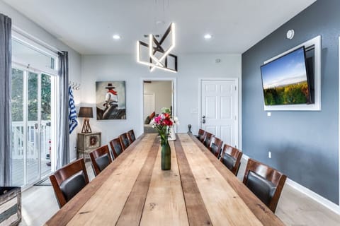 Giant tv monitor in the dining room with access to the large balcony