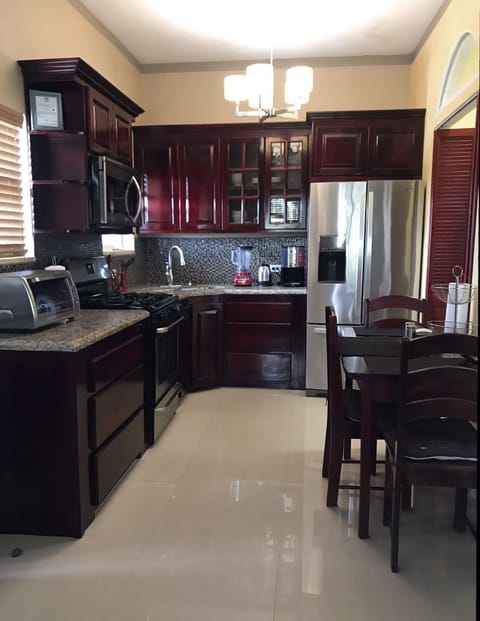 Fully Furnished Luxury Apartments | Private kitchen | Stovetop, coffee/tea maker, electric kettle, paper towels