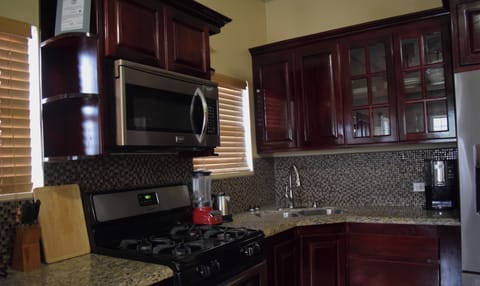 Fully Furnished Luxury Apartments | Private kitchen | Stovetop, coffee/tea maker, electric kettle, paper towels