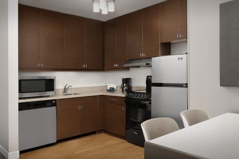 Suite, 2 Bedrooms | Private kitchen | Fridge, microwave, stovetop, dishwasher