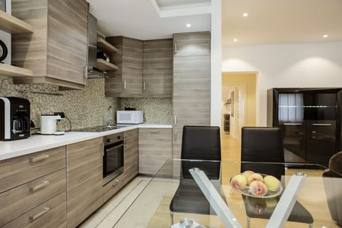 Executive Apartment, 1 Bedroom | Private kitchen | Fridge, microwave, dishwasher, coffee/tea maker