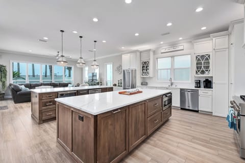 Galley Style Kitchen With Two Serving Islands