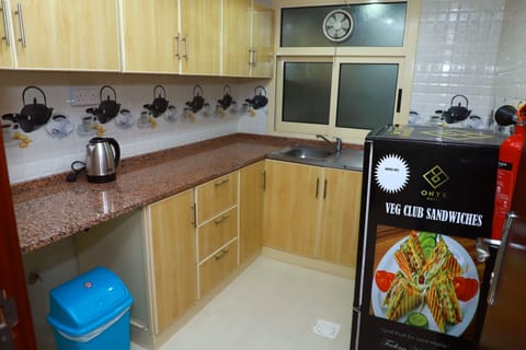Family Apartment, 2 Bedrooms | Private kitchen | Fridge, cookware/dishes/utensils