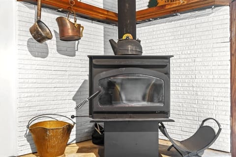 How cabin can you get with this wood stove and coal bucket