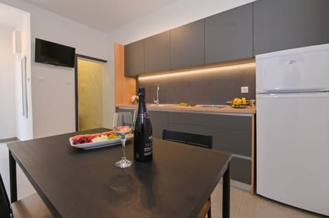 Apartment, 2 Bedrooms, Balcony | Private kitchen | Fridge, stovetop, electric kettle, cookware/dishes/utensils