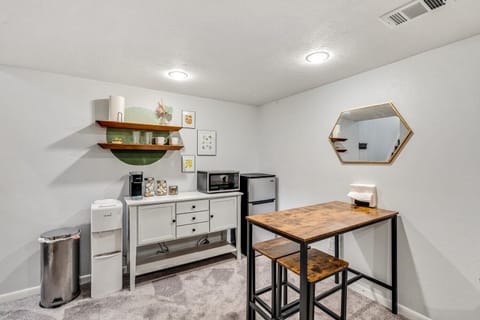 Kitchenette with fridge/freezer, microwave, Keurig, and hot/cold water dispenser