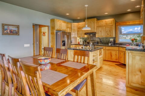 Lovely Wooden Dining Table next to Kitchen
