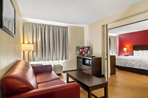 Suite, 1 King Bed with Sofa bed (Smoke Free) | Desk, blackout drapes, iron/ironing board, free WiFi