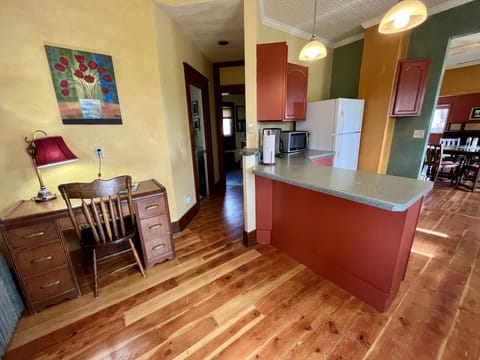 Cozy desk off the kitchen area for office use. 