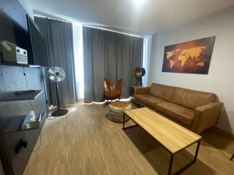 Suite | Living area | 20-inch flat-screen TV with cable channels, TV