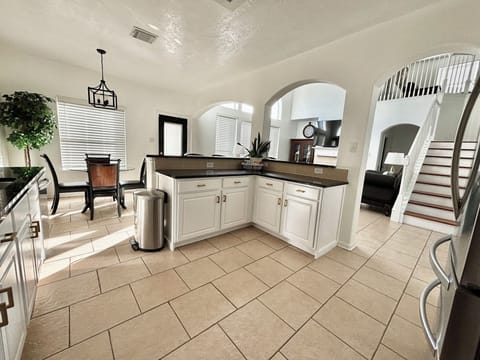Kitchen with All Stainless-steel appliance, Granite bar style counter tops.