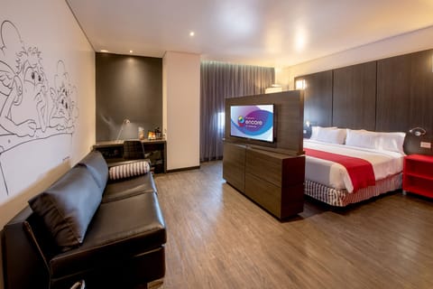 Junior Suite, 1 King Bed | In-room safe, desk, iron/ironing board, free WiFi