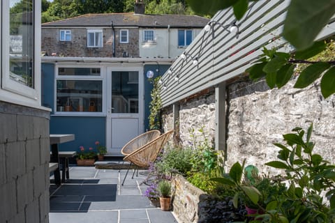 Our perfect sun trap courtyard garden, with an outhouse with washer/drier