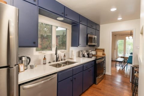 Main level full kitchen with stainless steel appliances.