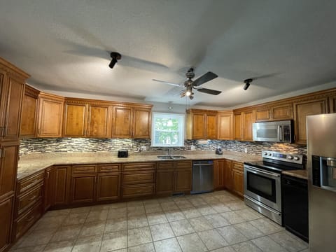 Well stocked well lit kitchen with undercabinet lights
